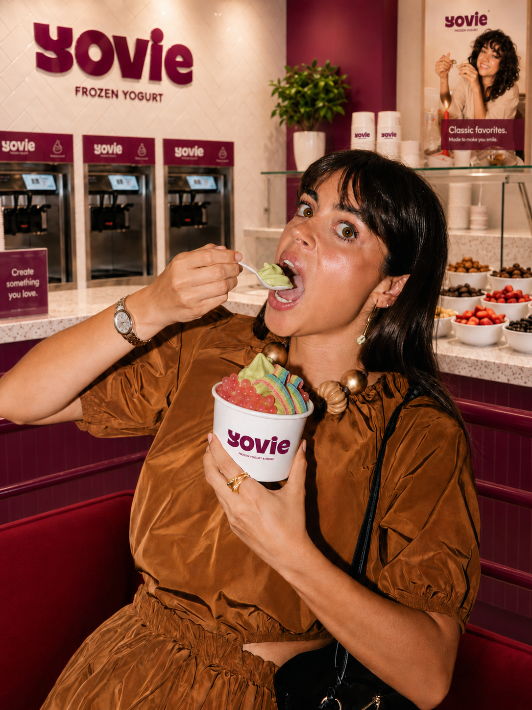 Customer enjoying YOVIE matcha frozen yoghurt inside a YOVIE frozen yoghurt franchise store in Melbourne